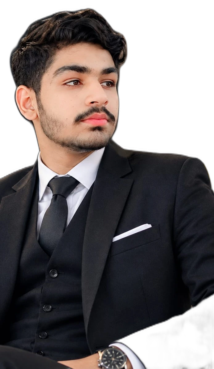 Taha Sarfraz wearing a black three-piece suit, looking to his left